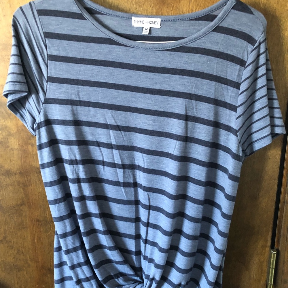 Blue striped tee shirt with knot in front. Size med. New without tags